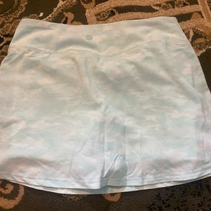 Light blue golf or tennis skirt.